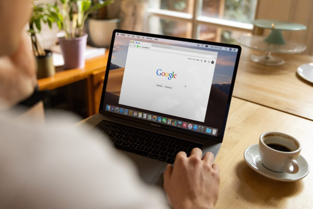 Person on computer looking at Google search